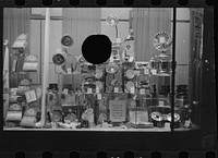 [Untitled photo, possibly related to: Drugstore window, Washington, D.C.] by Russell Lee