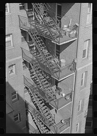 Rear stairs of apartment house, L Street, N.W., Washington, D.C. by Russell Lee