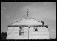 [Untitled photo, possibly related to: Southeast Missouri Farms. Erecting gable end on house] by Russell Lee