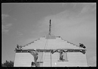[Untitled photo, possibly related to: Southeast Missouri Farms. Erecting gable end on house] by Russell Lee