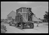[Untitled photo, possibly related to: House erection. Delivery of materials. Completed standard load of shop assembled panels. Southeast Missouri Farms Project] by Russell Lee