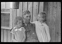 Sharecropper with two grandchildren, Southeast Missouri Farms by Russell Lee