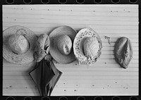 La Forge Farms, Missouri. Hats and an umbrella in a school for s near the FSA (Farm Security Administration) project for the rehabilitation of farm labor in southeastern Missouri by Russell Lee