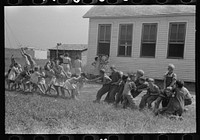 [Untitled photo, possibly related to: Tug-of-war at school, Southeast Missouri Farms Project] by Russell Lee