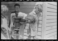 Schoolchildren drinking from the water pump, Southeast Missouri Farms by Russell Lee