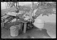 Water supply, near house occupied by FSA (Farm Security Administration) client, near Caruthersville, Missouri by Russell Lee