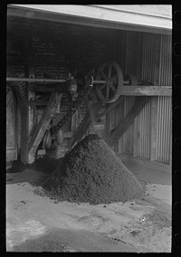 Refuse from rice mill constitutes a very small percentage of total. Most of the byproducts have found a use and consumption. State mill, Abbeville, Louisiana by Russell Lee