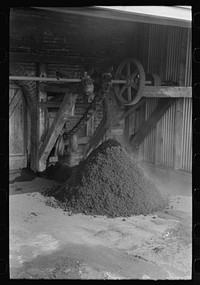 [Untitled photo, possibly related to: Refuse from rice mill constitutes a very small percentage of total. Most of the byproducts have found a use and consumption. State mill, Abbeville, Louisiana] by Russell Lee