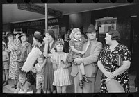 [Untitled photo, possibly related to: People waiting on sidewalk for parade, National Rice Festival, Crowley, Louisiana] by Russell Lee