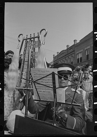 Member of Southwestern University band with instrument, National Rice Festival, Crowley, Louisiana by Russell Lee