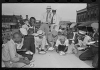 Rice eating contest, National Rice Festival, Crowley, Louisiana by Russell Lee