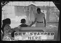 [Untitled photo, possibly related to: Everyone must be stamped to gain readmittance, for identification, state fair, Donaldsonville, Louisiana] by Russell Lee
