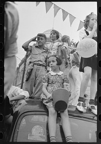 [Untitled photo, possibly related to: Group of people at southern Louisiana state fair, Donaldsonville, Louisiana] by Russell Lee