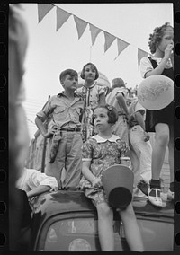 [Untitled photo, possibly related to: Group of people at southern Louisiana state fair, Donaldsonville, Louisiana] by Russell Lee