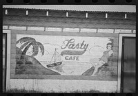 Sign on side of restaurant, New Iberia, Louisiana by Russell Lee