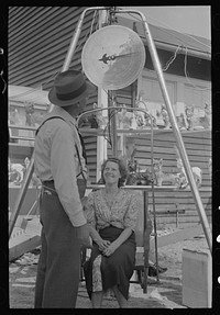 Woman being weighed, state fair, Donaldsonville, Louisiana by Russell Lee