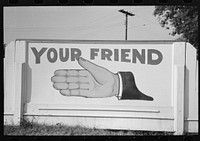 Sign at gas station, advertising a particular brand of petroleum product, New Iberia, Louisiana by Russell Lee