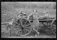 [Untitled photo, possibly related to: Farm girl leaning on wagon, near Morganza, Louisiana] by Russell Lee