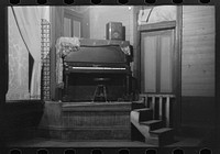 [Untitled photo, possibly related to: Piano on platform in auditorium, New Iberia, Louisiana] by Russell Lee