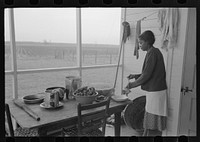 Farmer's wife grinding meat to make sausage, Lakeview Project, Arkansas by Russell Lee