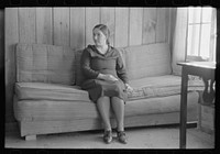 Wife of Chicot Farms homesteader sitting on homemade sofa, Chicot Farms, Arkansas by Russell Lee