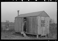 Shack of day laborer who works in sugarcane fields. He comes from a parish in northern Louisiana. Near New Iberia by Russell Lee