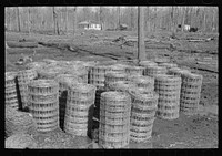 Woven wire for fences, Chicot Farms, Arkansas by Russell Lee