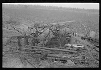 Because of lack of storage space it is necessary to keep agricultural implements in the open. Sharecropper farm near Pace, Mississippi. Background photo for Sunflower Plantation by Russell Lee