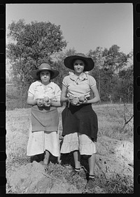Children of sharecropper with sweet potatoes near Laurel, Mississippi by Russell Lee