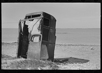 Privy made of old automobile bodies, Nueces Bay, Corpus Christi, Texas. Migrant camp by Russell Lee