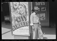 Mexican man in front of movie theater, San Antonio, Texas by Russell Lee