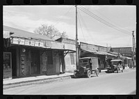 [Untitled photo, possibly related to: Street scene in Mexican district of San Antonio, Texas] by Russell Lee