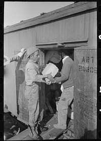 [Untitled photo, possibly related to: Icing refrigerator car, La Pryor, Texas] by Russell Lee