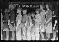 Schoolchildren waiting in line to go to the movies, San Augustine, Texas by Russell Lee