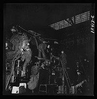 [Untitled photo, possibly related to: Chicago, Illinois. Locomotive under repair at the Chicago and Northwestern Railroad shops]. Sourced from the Library of Congress.
