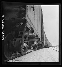 Freight operations on the Indiana Harbor Belt railroad between Chicago, Illinois and Hammond, Indiana. Train inspection. Sourced from the Library of Congress.