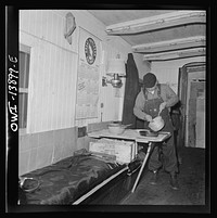 Freight operations on the Indiana Harbor Belt railroad between Chicago, Illinois and Hammond, Indiana. Some of the crews do their own cooking in the caboose. Sourced from the Library of Congress.