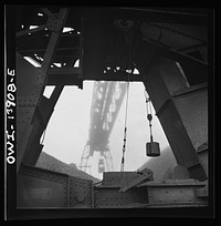 [Untitled photo, possibly related to: A worker employed at the car-loading end of a bridge at the Milwaukee Western Fuel Company. Milwaukee, Wisconsin]. Sourced from the Library of Congress.