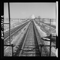 Freight train operations on the Chicago and Northwestern Railroad between Chicago and Clinton, Iowa. Reaching a speed of sixty-three miles per hour, the train speeds across northern Illinois. Sourced from the Library of Congress.