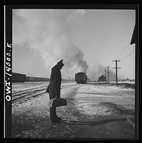 Freight train operations on the Chicago and Northwestern Railroad between Chicago and Clinton, Iowa. At the end of the trip, the engine goes off to the roundhouse as conductor Wolfsmith waves good-bye to the engine crew. Sourced from the Library of Congress.