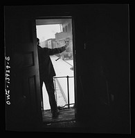 Freight operations on the Indiana Harbor Belt railroad between Chicago, Illinois and Hammond, Indiana. When two train pass, the rear brakeman for each watches the other train and if there are no hotboxes or other damage he gives the high sign. Sourced from the Library of Congress.