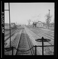 Freight train operations on the Chicago and Northwestern Railroad between Chicago and Clinton, Iowa. The train going through the town to the yard which is two miles beyond. Sourced from the Library of Congress.