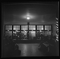 [Untitled photo, possibly related to: Chicago, Illinois. Baggage check room at the Union Station]. Sourced from the Library of Congress.