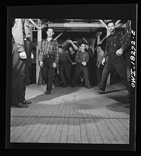 [Untitled photo, possibly related to: Madison, Wisconsin. Farm short course school at the University of Wisconsin. Interest in rural culture and customs is stimulated at the school. This class in rural society often practices square dances]. Sourced from the Library of Congress.