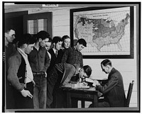 Madison, Wisconsin. Farm short course school at the University of Wisconsin. Mr. William Stemmler, school counselor, distributing allowance checks (four dollars per two weeks) to the students. Sourced from the Library of Congress.