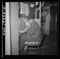 [Untitled photo, possibly related to: Conductor George E. Burton, having lunch in the caboose on the Atchison, Topeka, and Santa Fe Railroad between Chicago and Chillicothe, Illinois]. Sourced from the Library of Congress.