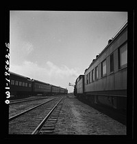 [Untitled photo, possibly related to: Chillicothe, Illinois. Changing crews and cabooses of a westbound freight train along the Atchison, Topeka and Santa Fe Railroad, between Chicago and Chillicothe, Illinois]. Sourced from the Library of Congress.