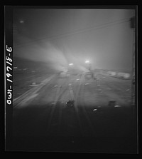 [Untitled photo, possibly related to: Argentine, Kansas. Night view of the Atchison, Topeka, and Santa Fe Railroad shops and roundhouse]. Sourced from the Library of Congress.