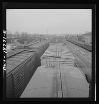 Argentine, Kansas. Westbound Atchison, Topeka and Santa Fe freight pulling out of the railroad yard between Argentine and Emporia, Kansas. Sourced from the Library of Congress.