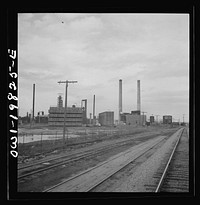 Wellington, Kansas. Passing an oil refinery on the Atchison, Topeka, and Santa Fe Railroad between Emporia and Wellington, Kansas. Sourced from the Library of Congress.